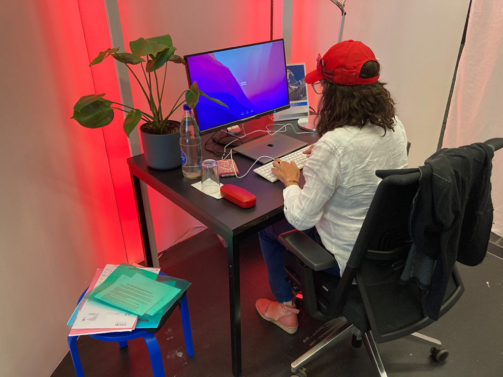 test person at desk in work area