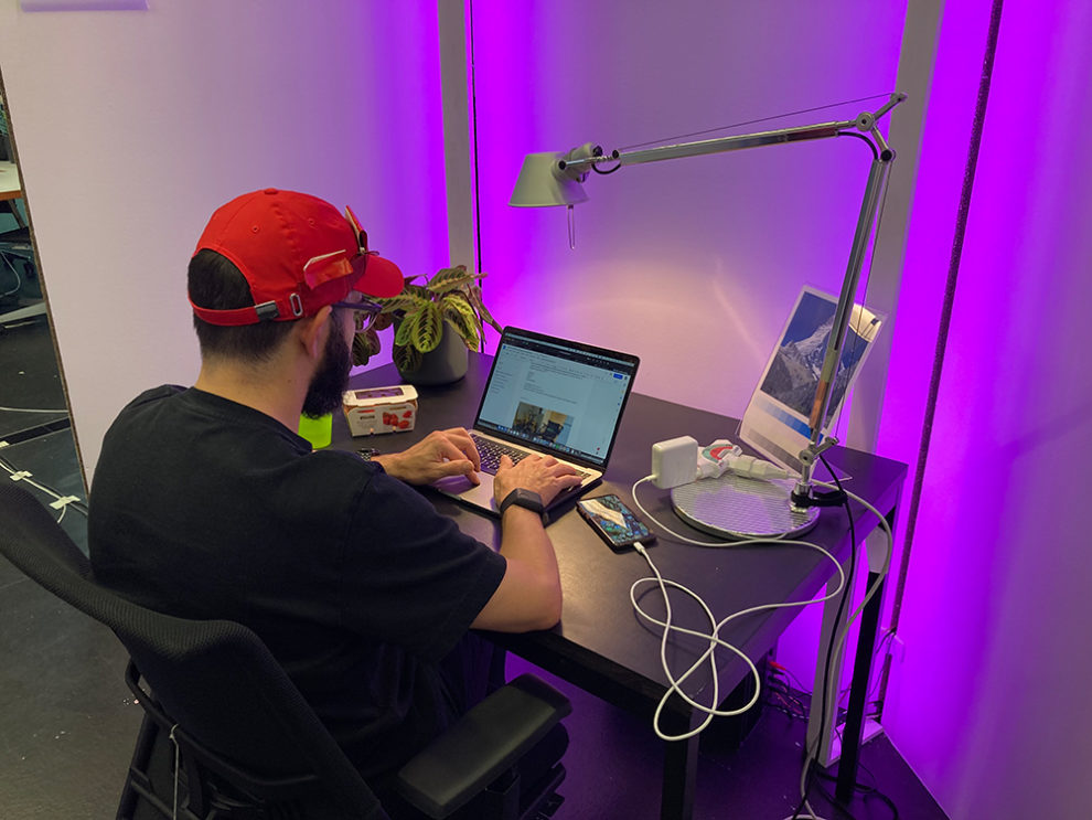 test person at desk in work area
